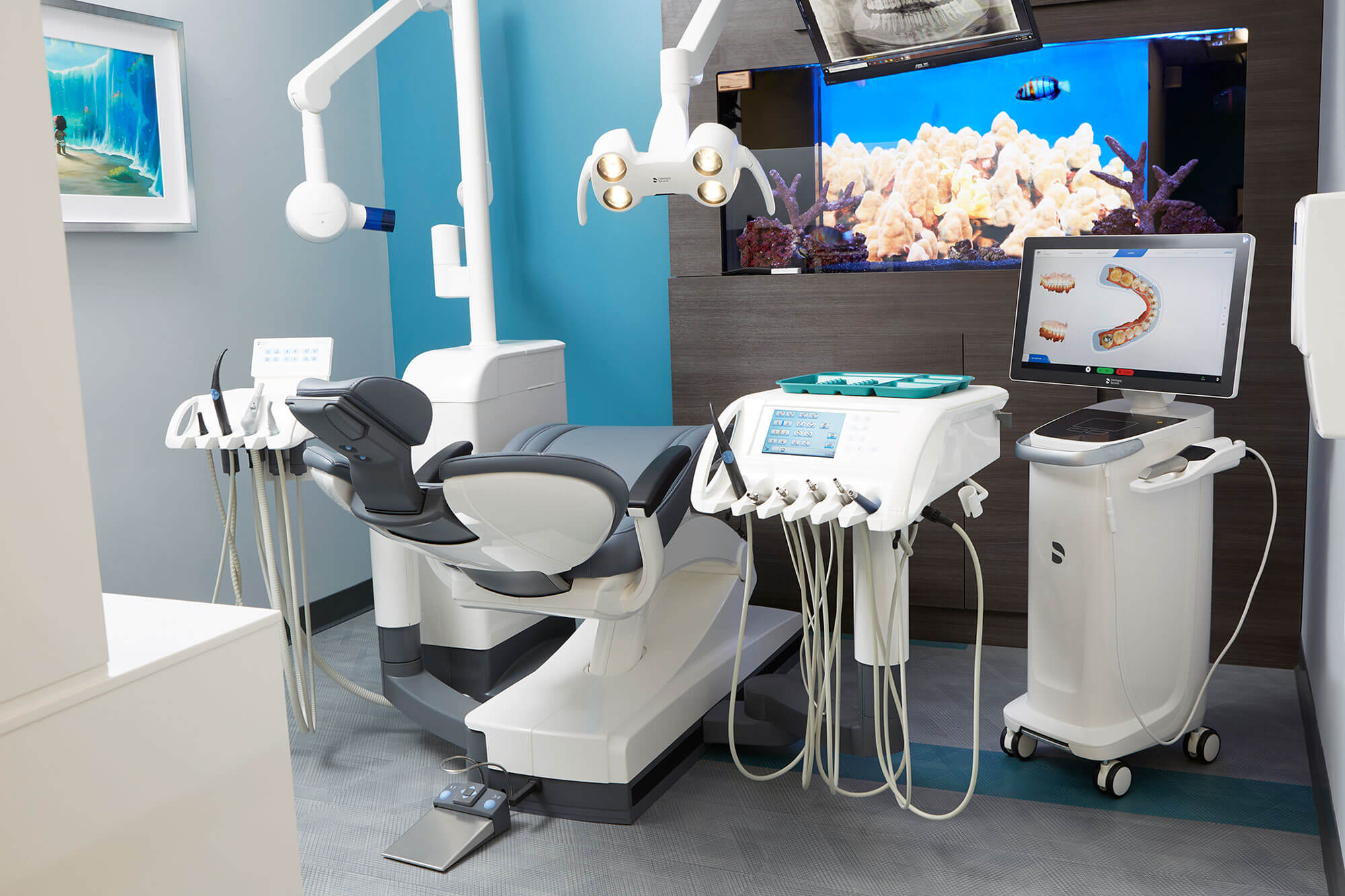 dental exam room with chair and dental equipment