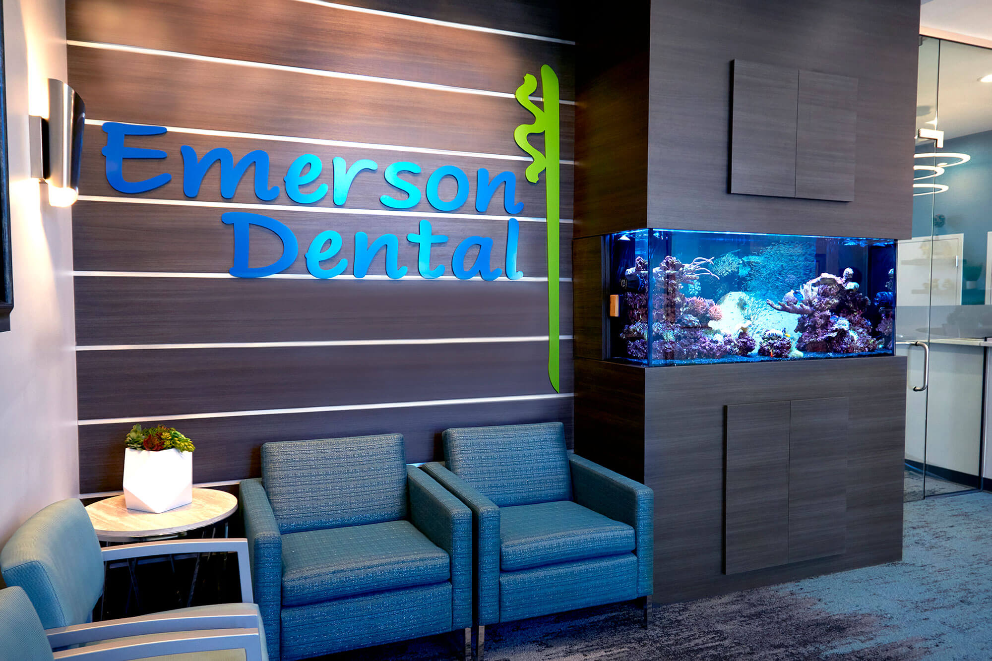 waiting room at Emerson Dental with fish tank in wall