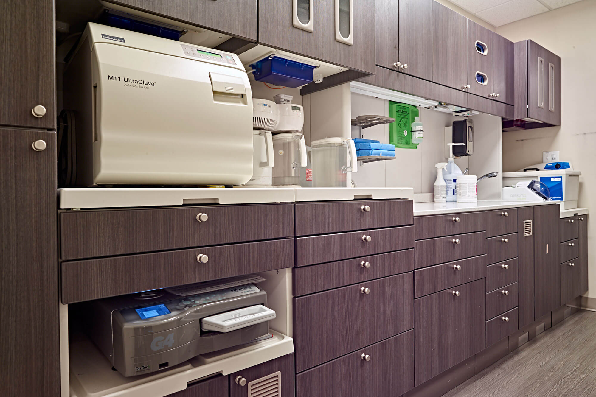 cabinets in work area of dental office with sterilizer